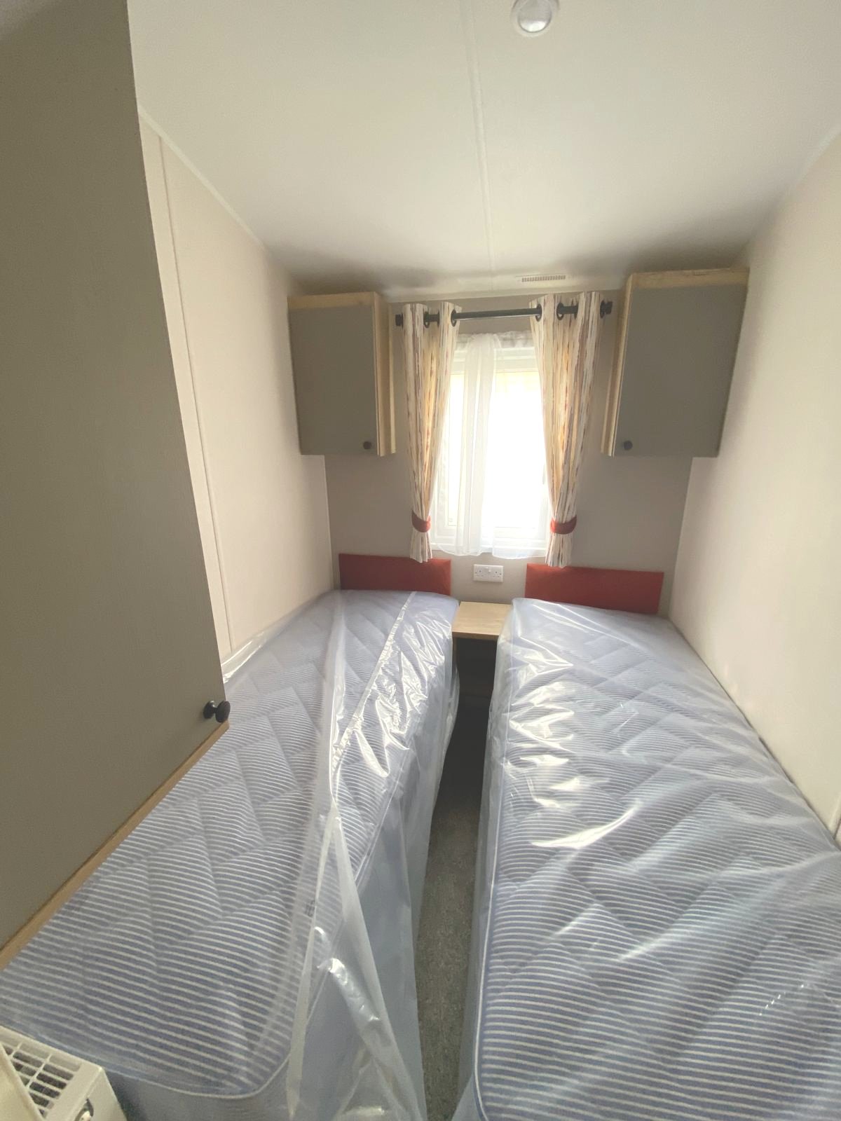 Twin Bedroom with Overhead Storage